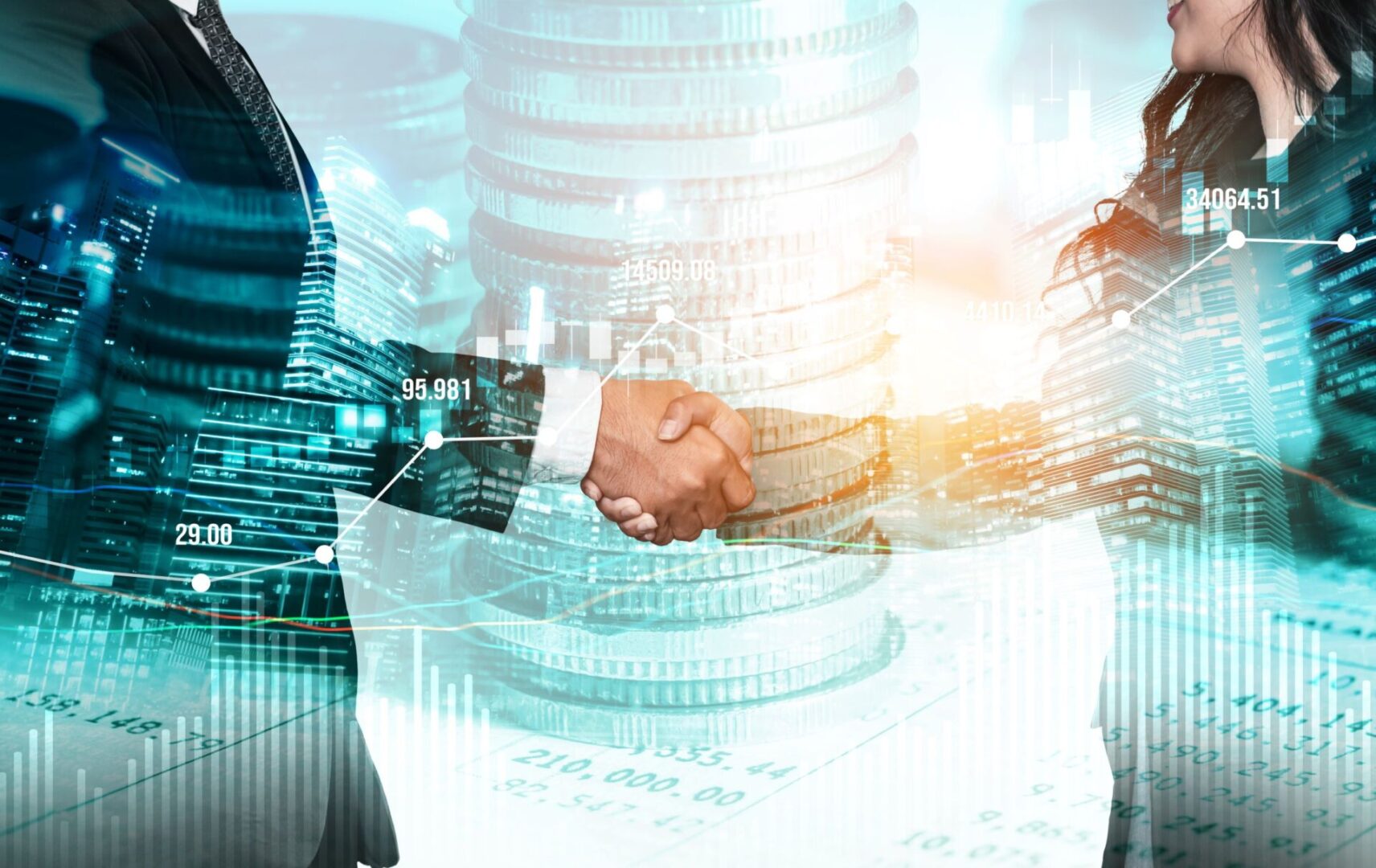 Two people shaking hands over a table with stacks of coins.